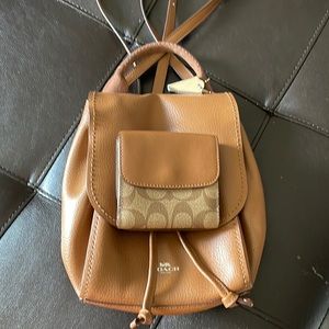 Very Gently used Coach mini backpack purse & wallet